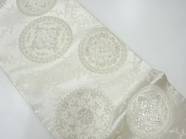 丸文に華文模様織出し袋帯